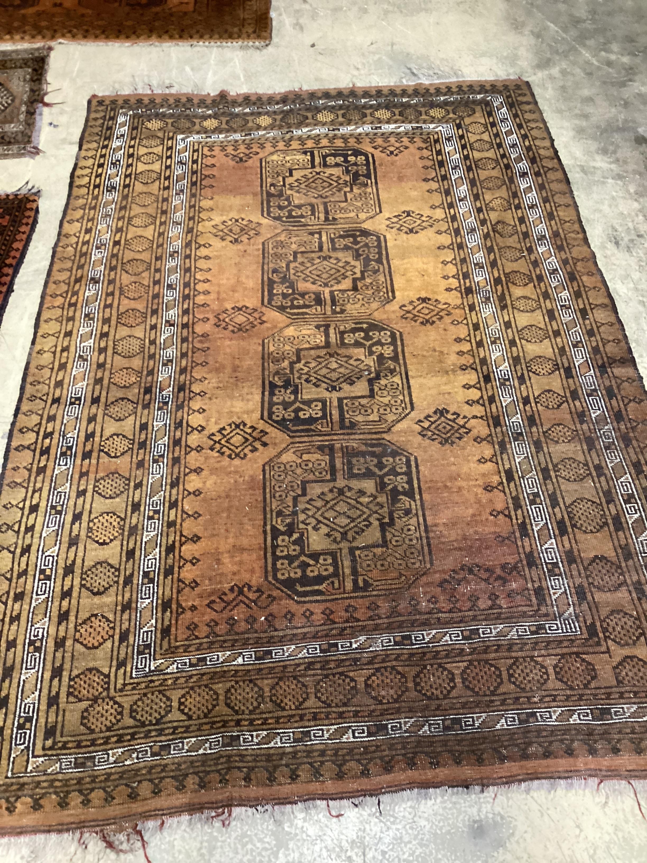 An Afghan gold ground rug, 224 x 151cm